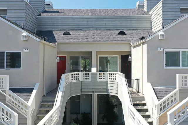 a view of an outside dining space with furniture
