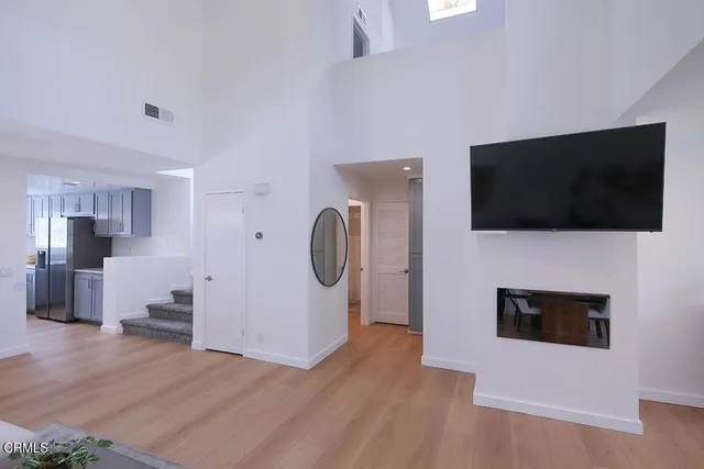 a view of a livingroom with furniture and a flat screen tv