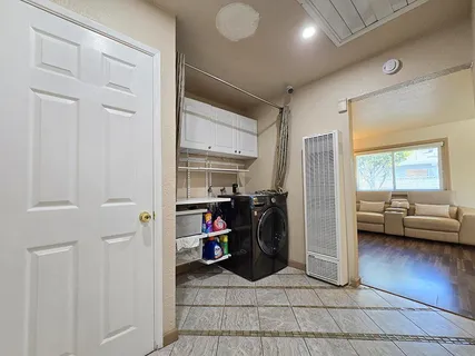 a view of a livingroom with furniture and a ceiling fan