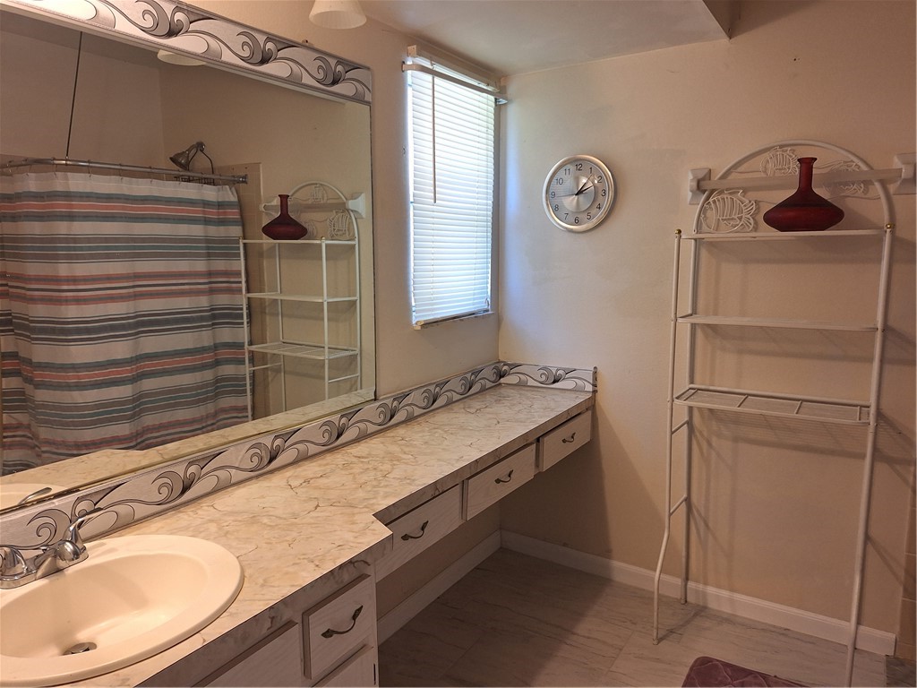 999 Laredo Lane Sebastian, FL 32958 - Photo 13 of 19 a bathroom with a sink and a mirror