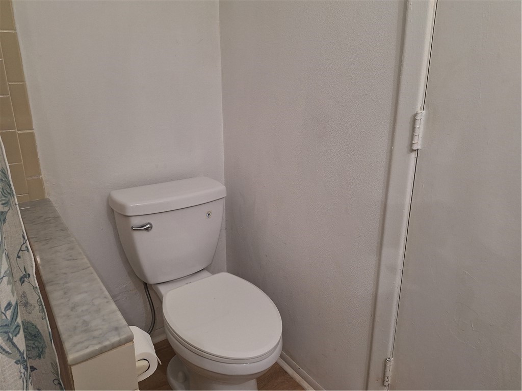 999 Laredo Lane Sebastian, FL 32958 - Photo 15 of 19 a white toilet sitting next to a shower
