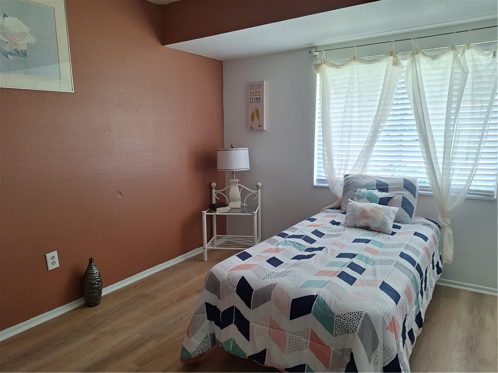 999 Laredo Lane Sebastian, FL 32958 - Photo 16 of 19 a bedroom with a bed and a window