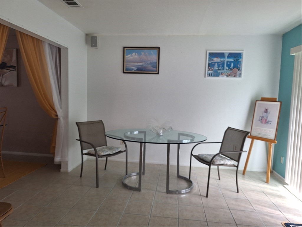 999 Laredo Lane Sebastian, FL 32958 - Photo 8 of 19 a view of a workspace with furniture and a couch