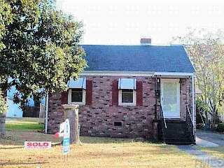 1133 Fuller Street Raleigh, NC 27603 - Photo 1 of 1 a front view of a house with garden
