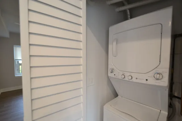 a view of washer and dryer with wooden floor