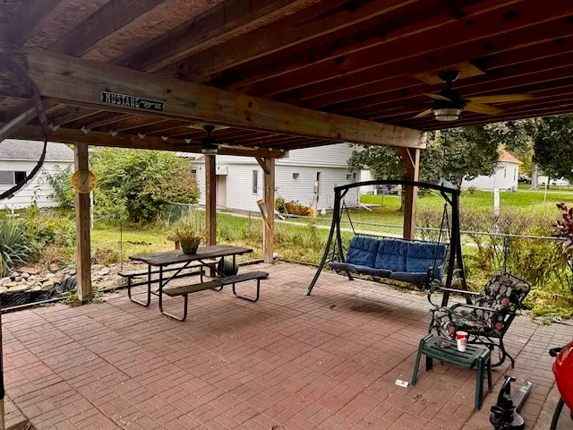 a view of a swimming pool with a patio
