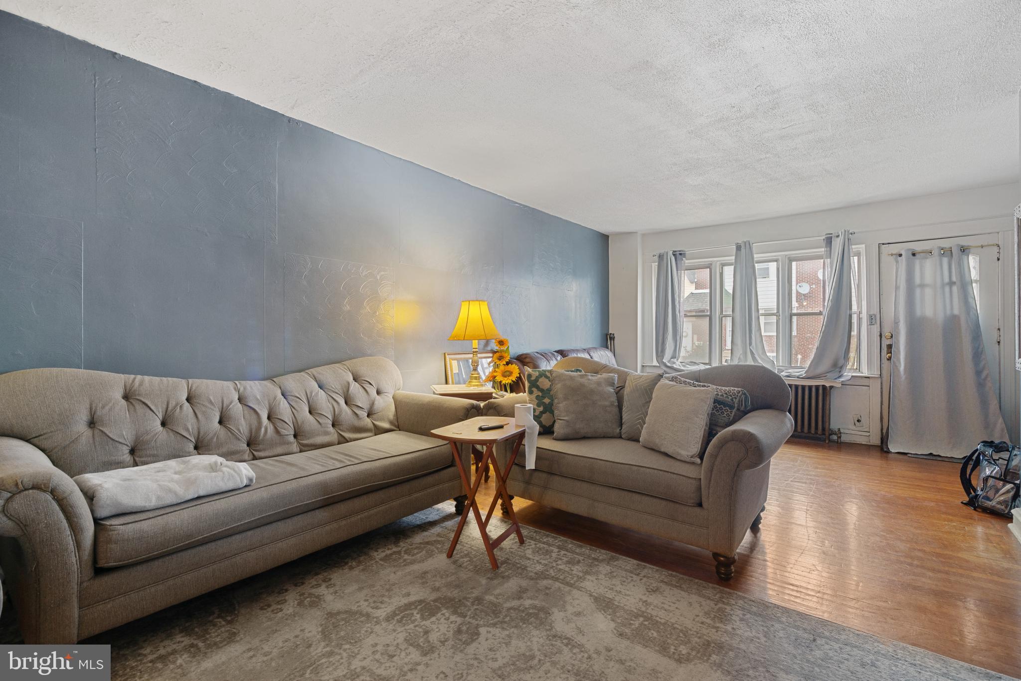 414 Hampden Road Upper Darby, PA 19082 - Photo 2 of 11 a living room with furniture and a large window