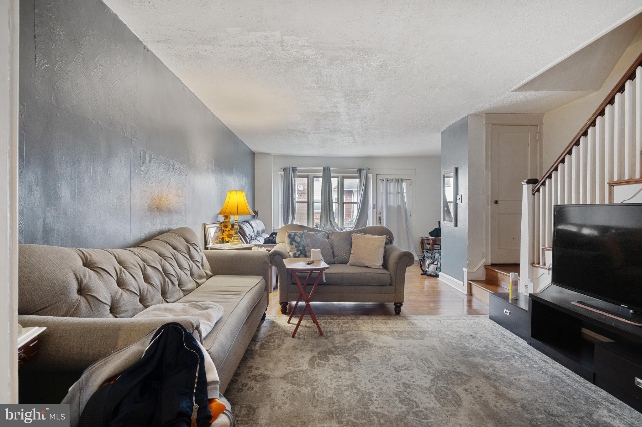414 Hampden Road Upper Darby, PA 19082 - Photo 4 of 11 a living room with furniture and a flat screen tv
