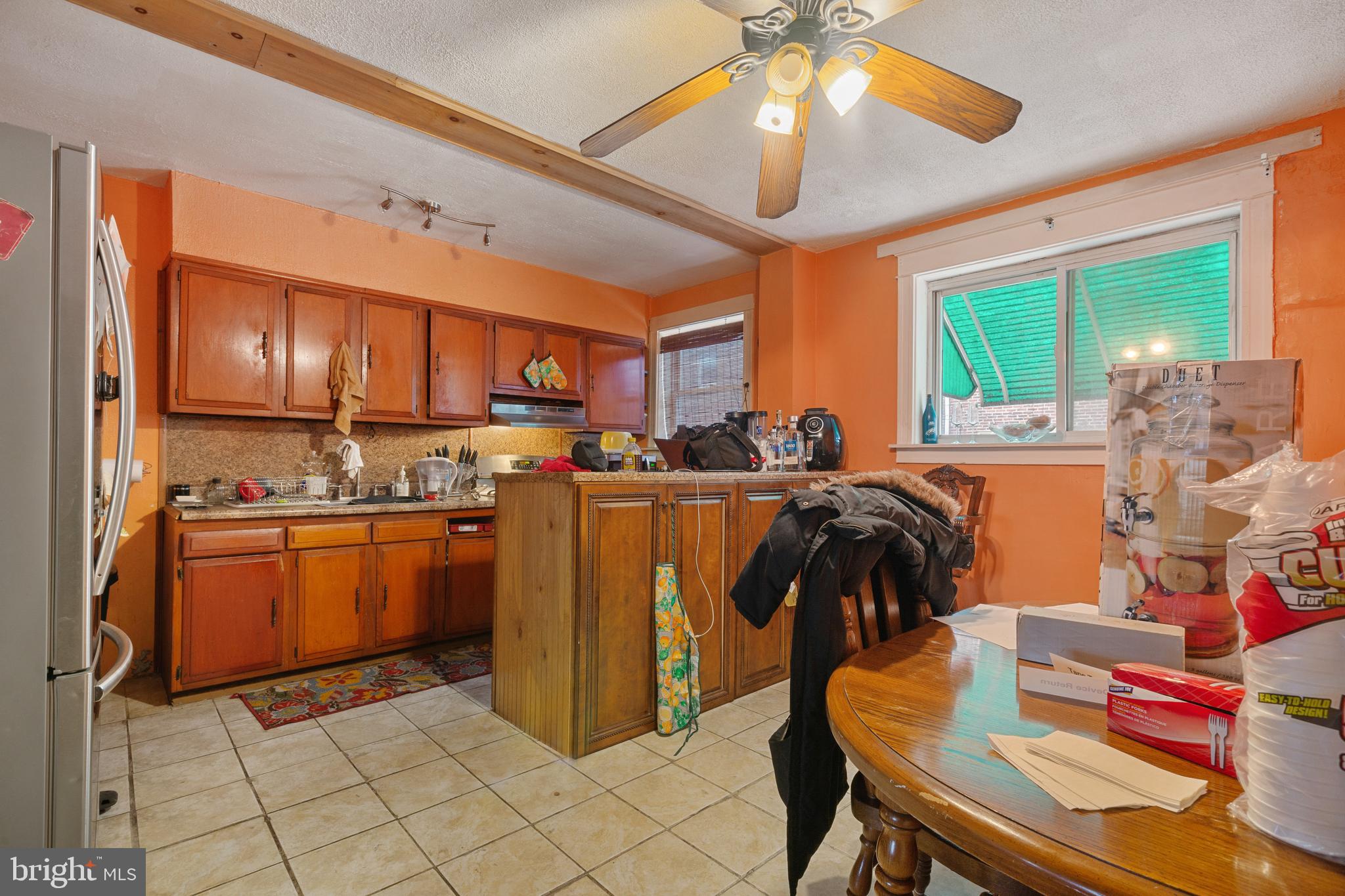 414 Hampden Road Upper Darby, PA 19082 - Photo 5 of 11 a view of kitchen with sink refrigerator dining table and chairs