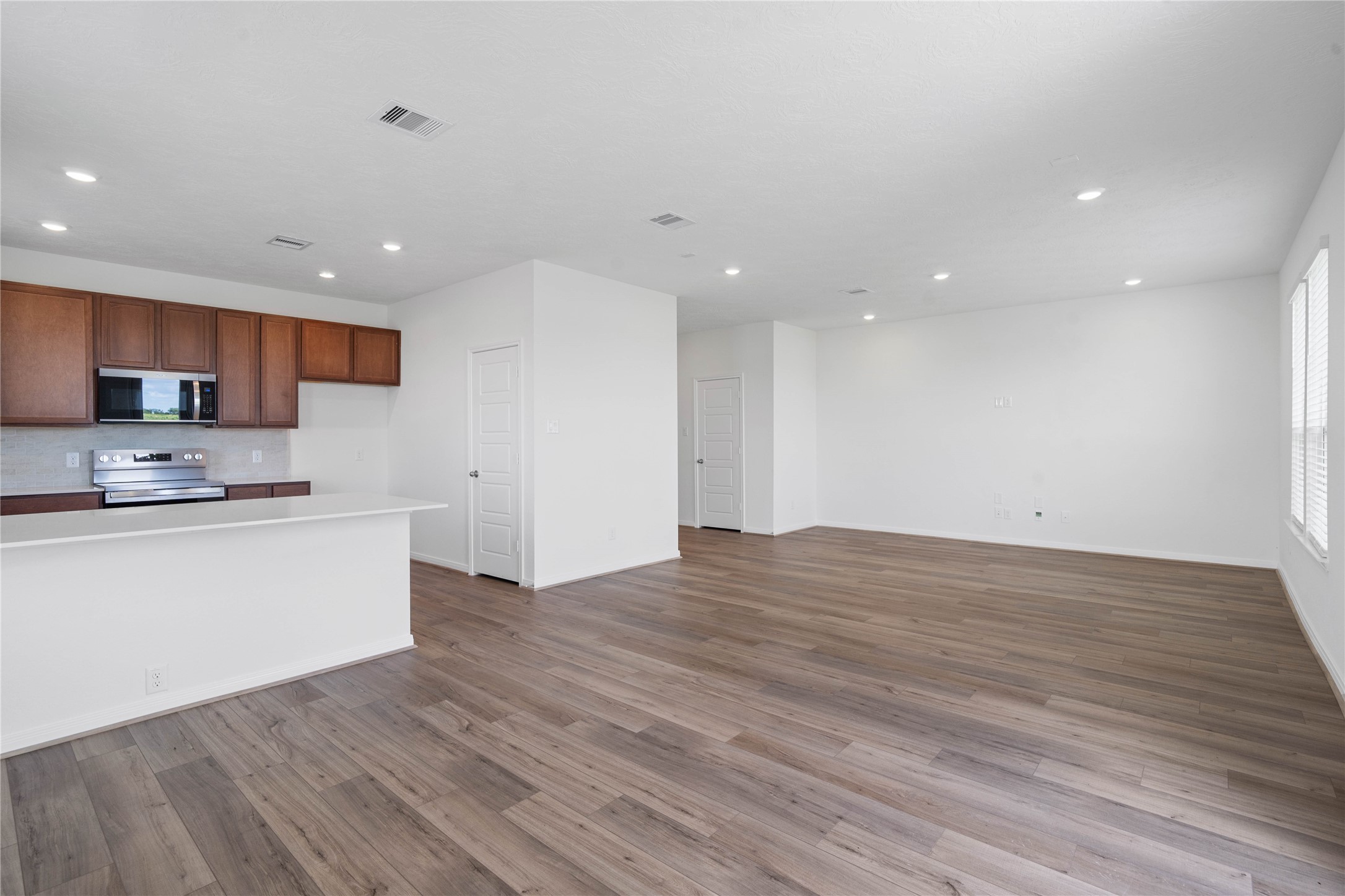 7210 Brooklea Road Beasley, TX 77417 - Photo 12 of 32 The bright open concept living space ensures everyone is connected from the family and dining rooms as well as the kitchen!