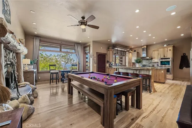 a bedroom with a bed a couch and a chandelier