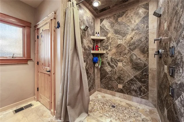 a bedroom with a large bed and a large window