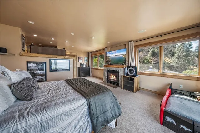 a front view of a house with a yard and potted plants