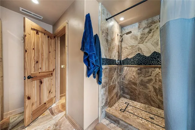 a view of a room with wooden walls