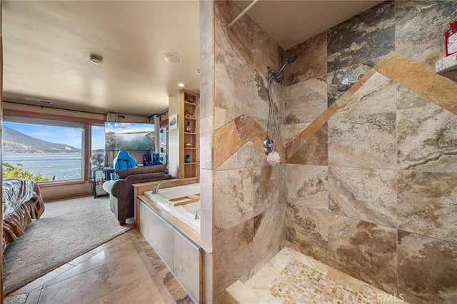 a room with lots of wooden furniture and potted plants