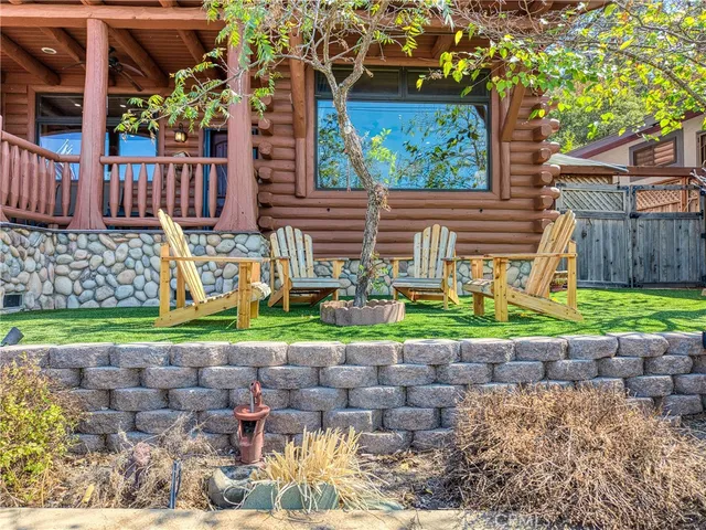 a front view of a house with a yard table and chairs
