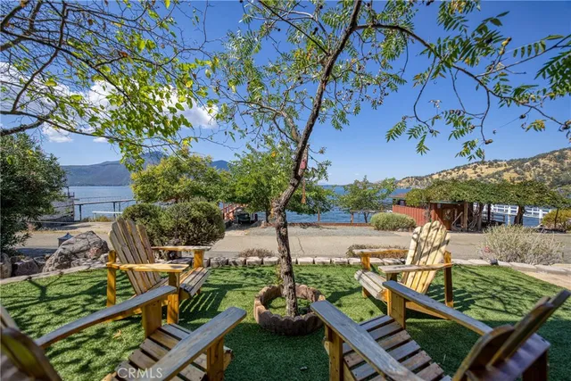 a front view of a house with tree s