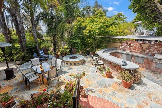 a view of a backyard with sitting area