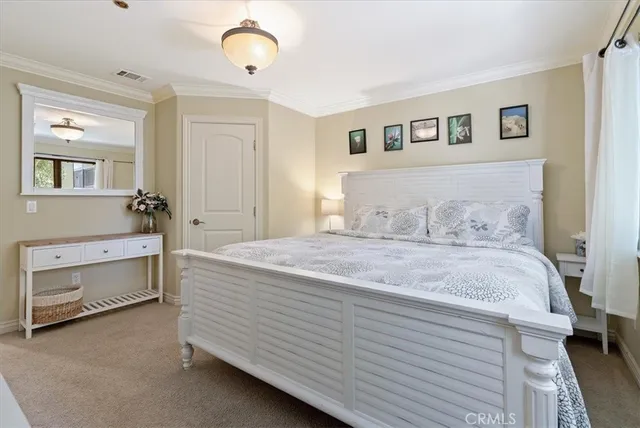 a bedroom with a bed and a table