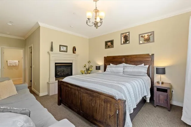 a bedroom with a bed and a fireplace