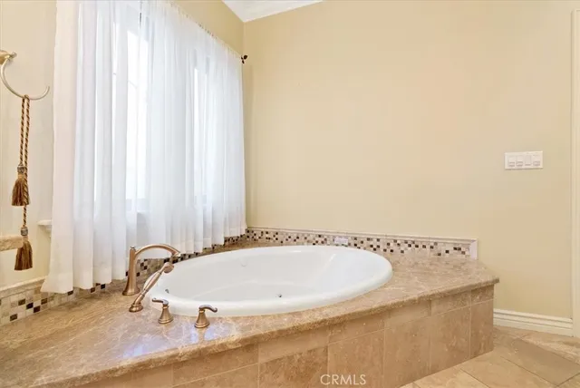 a bathroom with a tub and a sink