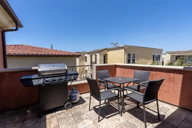 a view of a terrace with furniture and stove