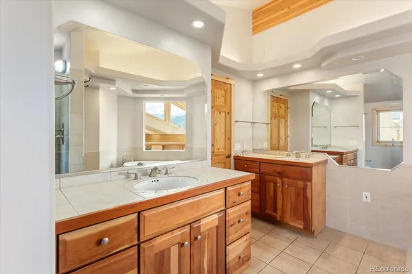 a bathroom with a sink double vanity and a mirror
