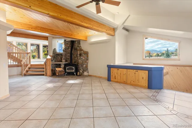 a view of living room with furniture and a rug