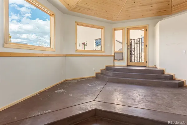 a bathroom with a bathtub and window