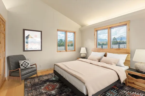 a bedroom with double bed and a window