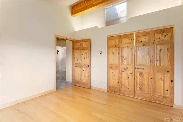 a view of an empty room with furniture and garage