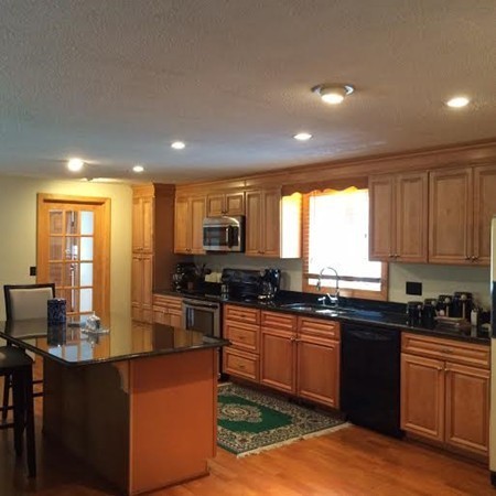 419 Wares Road Ashby, MA 01431 - Photo 3 of 21 a kitchen with kitchen island granite countertop a sink counter top space a refrigerator and cabinets