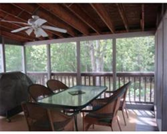 419 Wares Road Ashby, MA 01431 - Photo 8 of 21 a view of a balcony with furniture and wooden floor