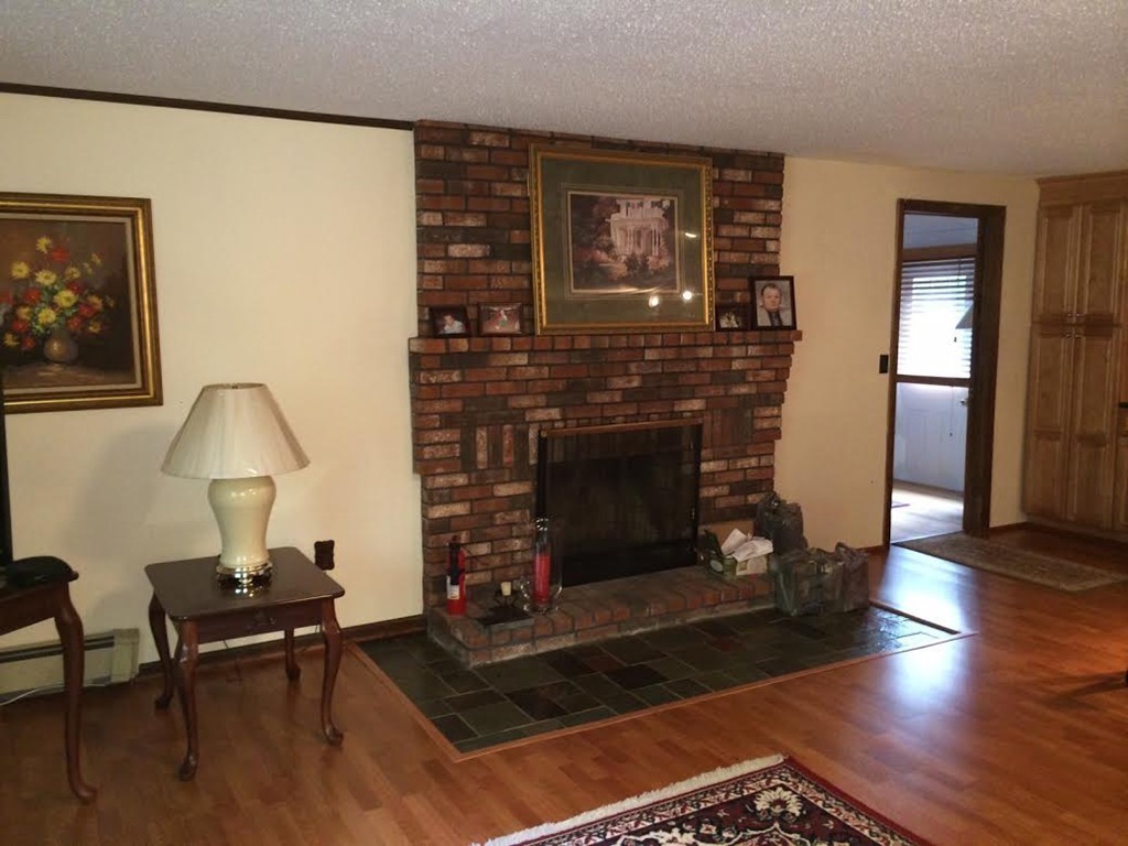 419 Wares Road Ashby, MA 01431 - Photo 10 of 21 a living room with furniture and a fireplace