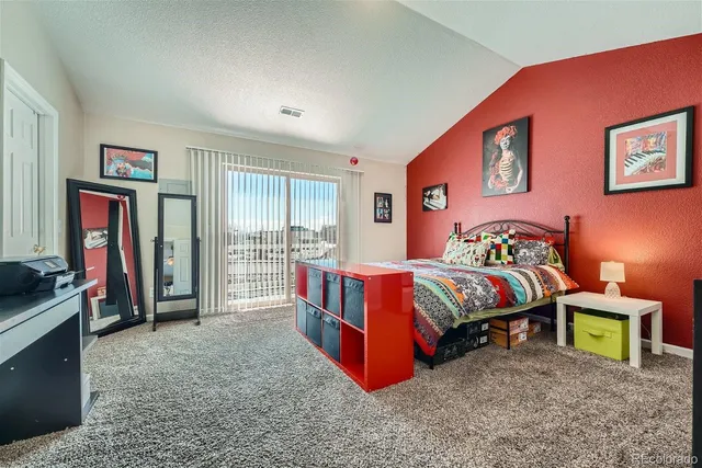 a bedroom with bed and a window