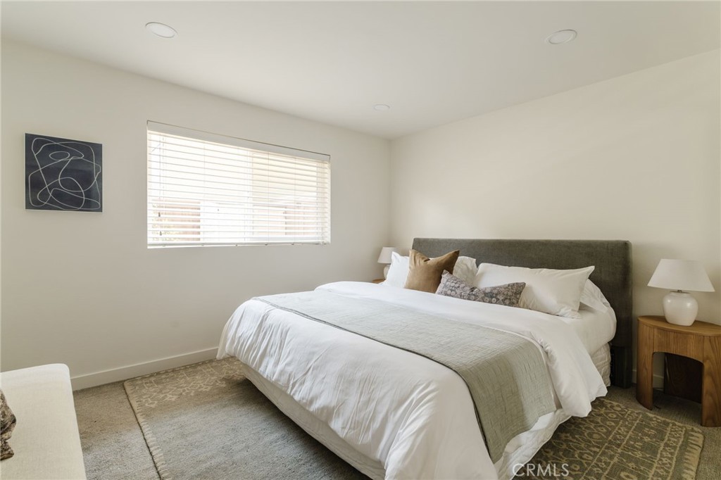 246 Alpine Street, Unit 5 Pasadena, CA 91106 - Photo 13 of 26 a bedroom with a bed and a window