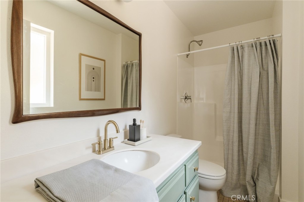 246 Alpine Street, Unit 5 Pasadena, CA 91106 - Photo 15 of 26 a bathroom with a sink toilet and shower