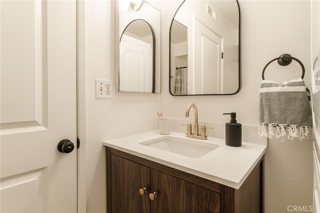 246 Alpine Street, Unit 5 Pasadena, CA 91106 - Photo 17 of 26 a bathroom with a sink and a mirror