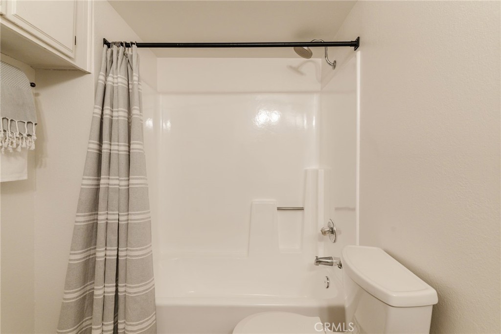 246 Alpine Street, Unit 5 Pasadena, CA 91106 - Photo 18 of 26 a bathroom with a shower and a toilet