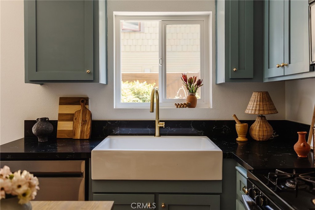 246 Alpine Street, Unit 5 Pasadena, CA 91106 - Photo 2 of 26 a kitchen with a sink and cabinets