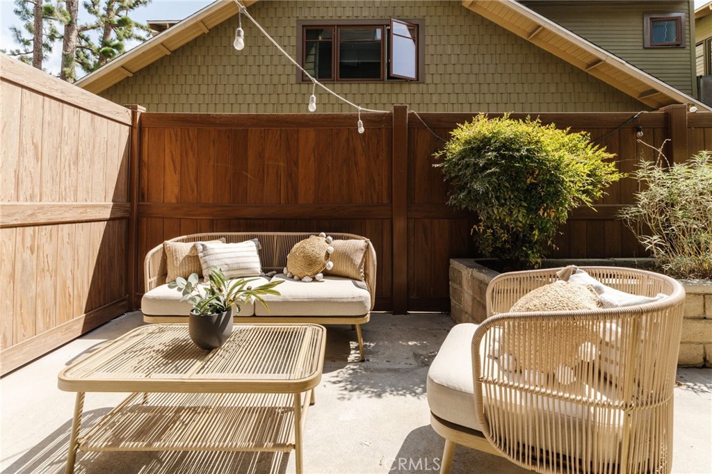 246 Alpine Street, Unit 5 Pasadena, CA 91106 - Photo 22 of 26 a roof deck with table and chairs under an umbrella