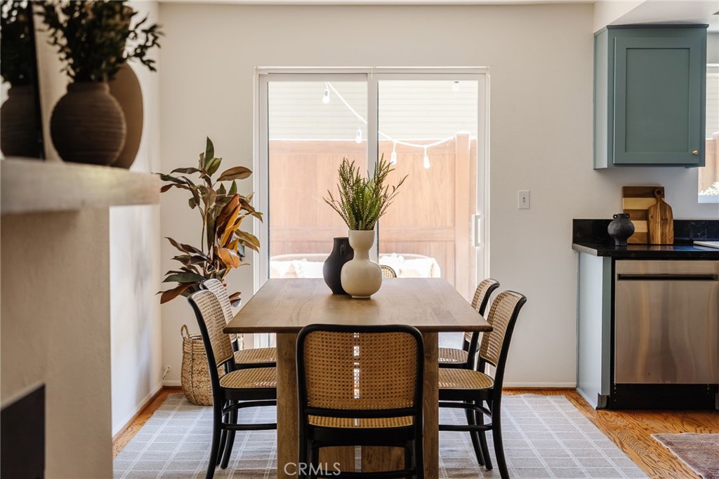 246 Alpine Street, Unit 5 Pasadena, CA 91106 - Photo 5 of 26 a view of a dining room with furniture and wooden floor