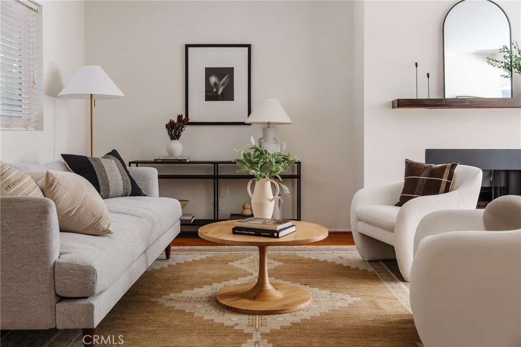 246 Alpine Street, Unit 5 Pasadena, CA 91106 - Photo 7 of 26 a living room with furniture and a potted plant