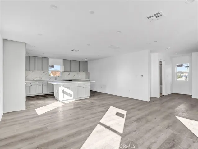 a view of kitchen with wooden floor