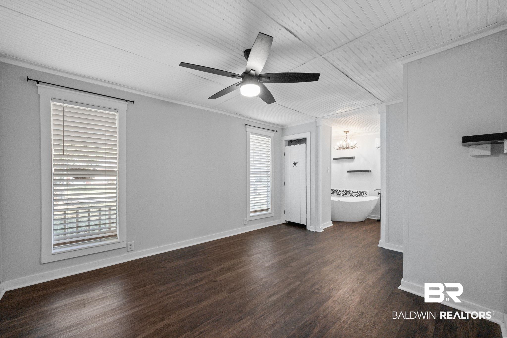503 North Holly Street Foley, AL 36535 - Photo 10 of 23 Unfurnished bedroom with ensuite bathroom, wood ceiling, ceiling fan, crown molding, and dark hardwood / wood-style floors