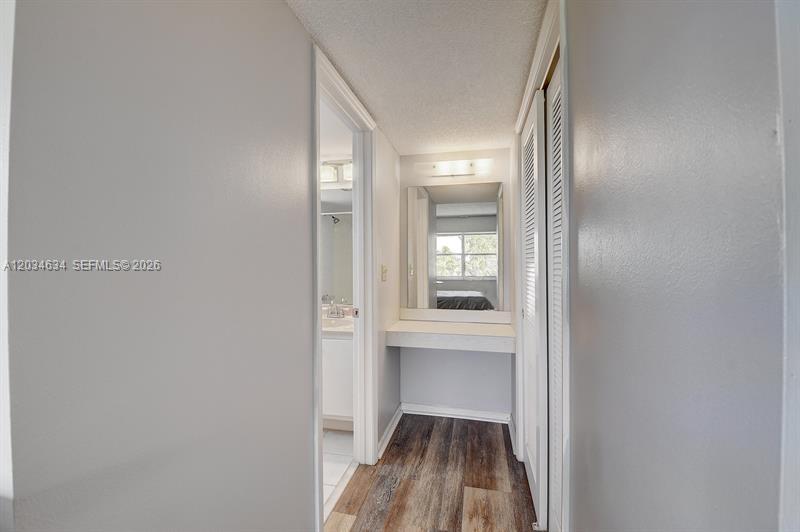 9880 Marina Boulevard, Unit 1516 Boca Raton, FL 33428 - Photo 13 of 32 a view of a room with wooden floor cabinet and windows