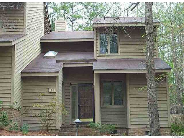 a front view of a house with garage