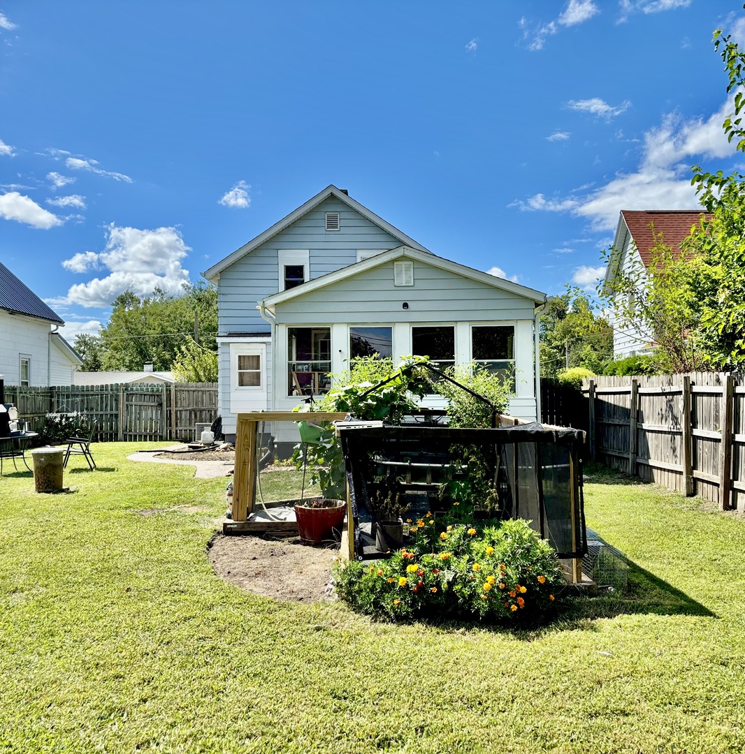 1410 3rd Avenue Sterling, IL 61081 - Photo 13 of 13 a front view of house with a garden