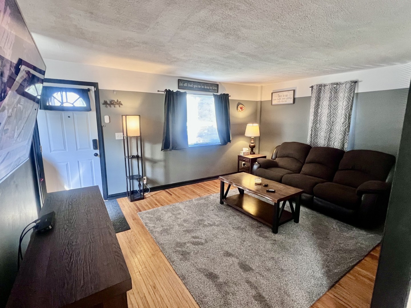 1410 3rd Avenue Sterling, IL 61081 - Photo 2 of 13 a living room with furniture and wooden floor