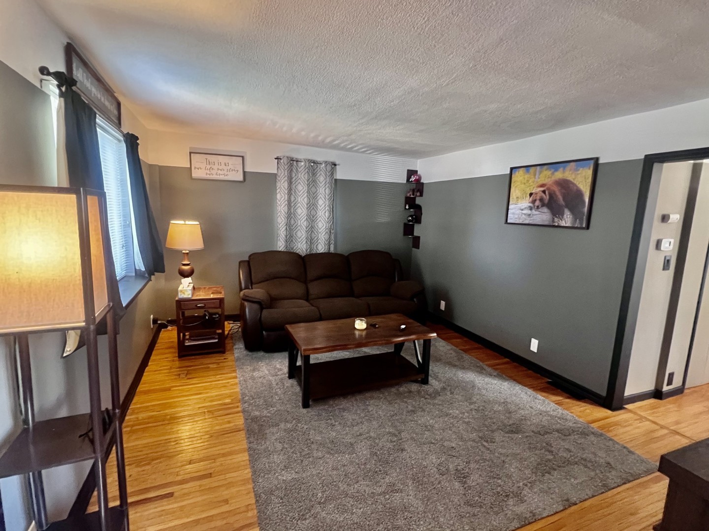 1410 3rd Avenue Sterling, IL 61081 - Photo 3 of 13 a living room with furniture and a rug